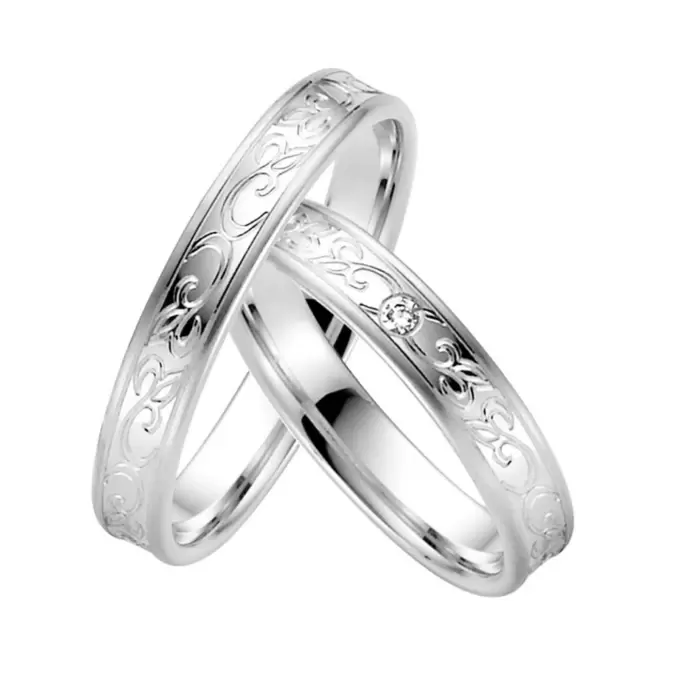 Konkave Eheringe Plagentum mit floralem Muster und 0,02 Karat Diamanten