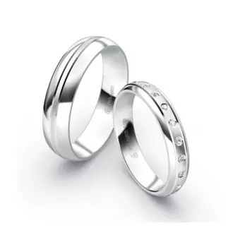 gerundete Plagentum Eheringe mit Rillendesign und 11 Diamanten