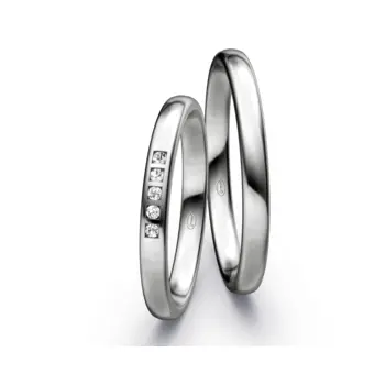 Platin Eheringe mit 5 weißen Diamanten in polierter Oberfläche