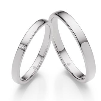 Hochpolierte Eheringe aus Weißgold mit einem 0,01 Karat Diamanten
