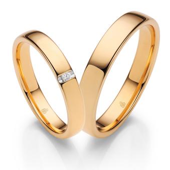 Klassische Eheringe aus poliertem Sommergold und Diamanten