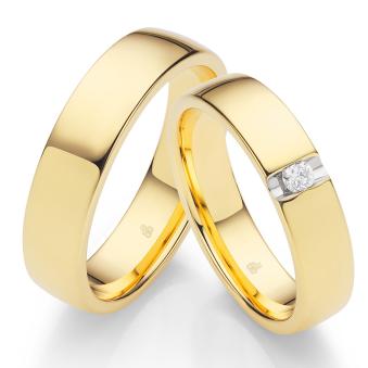 Polierte Eheringe aus Gelbgold mit einem Diamanten