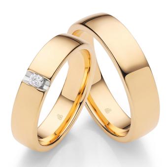 Eheringe aus poliertem Sommergold mit einem Diamant