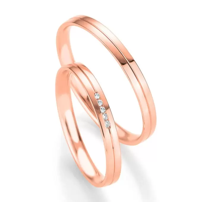 Polierte Eheringe aus Rotgold mit 5 Diamanten in Kanalfassung
