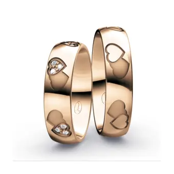 Eheringe aus Rotgold mit Herzchen-Muster und 18 Diamanten