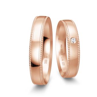 Eheringe aus Rotgold mit Diamanten und Millgriff Muster