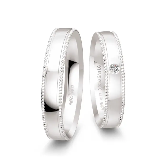 Eheringe aus Silber 925 mit Labor Diamanten und Millgriffmuster am Rand