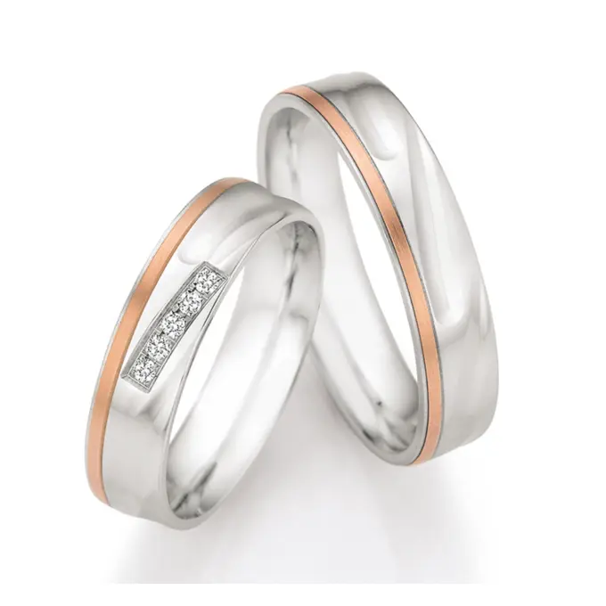 Silber & Rotgold Trauringe mit 4 Diamanten in Kanalfassung