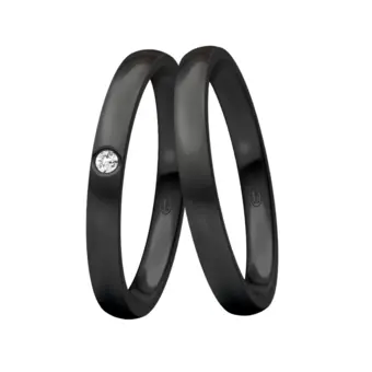 Trauringe aus schwarzem sandmattem Stahl mit weißen Diamanten