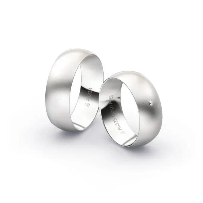 Weissgold Eheringe mit Diamanten und Sandmattierung in 7 mm Breite 