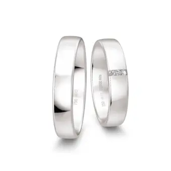 Mit Polierung veredelte Weißgold Eheringe mit drei Diamanten je 0,01 Karat