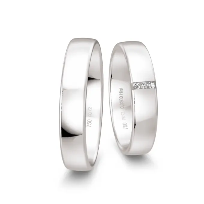 Mit Polierung veredelte Weißgold Eheringe mit drei Diamanten je 0,01 Karat