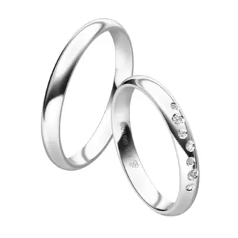 Eheringe aus poliertem Weißgold mit 7 Diamanten in Sternenhimmel Design