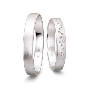 Matte Trauringe aus Weissgold mit vielen Diamanten als Sternenhimmel