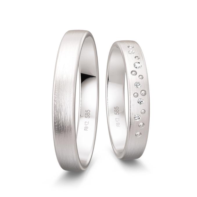 Matte Trauringe aus Weissgold mit vielen Diamanten als Sternenhimmel