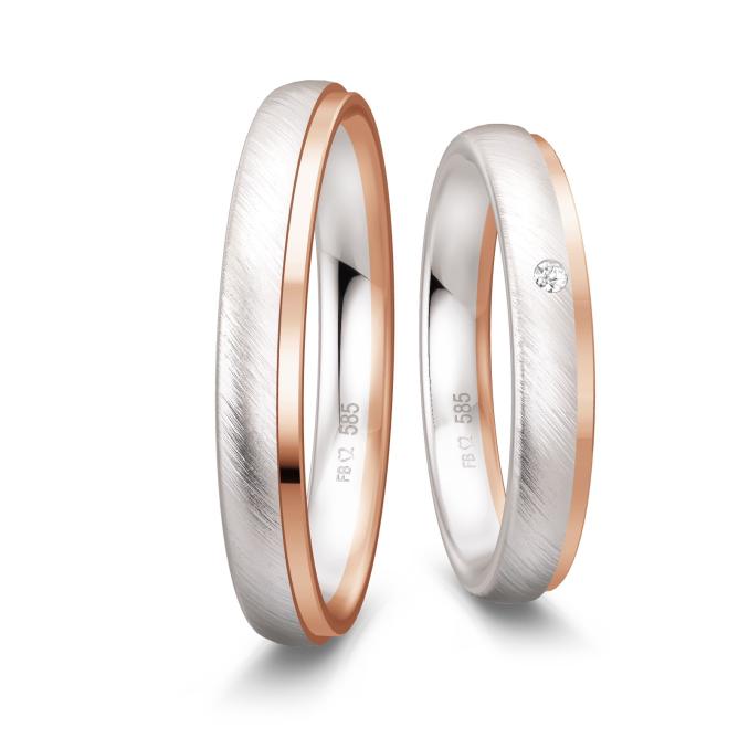 Weißgold Trauringe mit Rand aus Roségold und Diamant