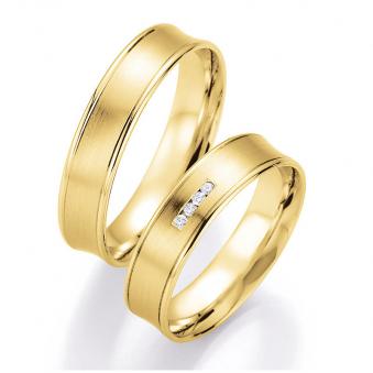 Aufnahme von konkaven Eheringen aus Gelbgold mit Diamanten und polierten Rändern