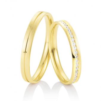 Aufnahme von schmalen Eheringe aus Gelbgold mit Diamanten und prominenter RIlle