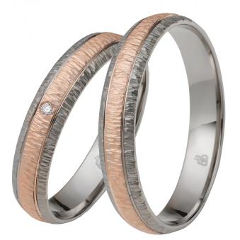 Aufnahme von außen gerundeten Rosésgold&Palladium Eheringen mit Diamanten und Strukturierung