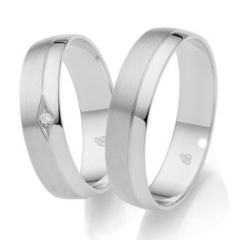 Platin Trauringe mit poliertem Rand und Diamanten in Vertiefung