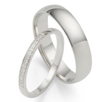 Platin Eheringe mit vielen Diamanten und Polierung breiter Herrenring und schmaler Damenring 