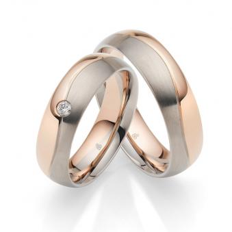 Aufnahme von Trauringen aus mattem Palladium 500 und poliertem Roségold mit Diamanten