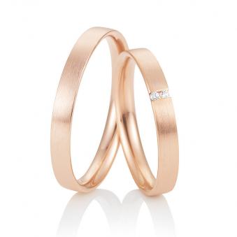 Aufnahme von Weißgold Eheringen mit zwei Diamanten und längsmatter Oberfläche