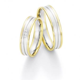 Aufnahme von konkaven Eheringen aus Weiß- & Gelbgold mit Diamanten matt poliert