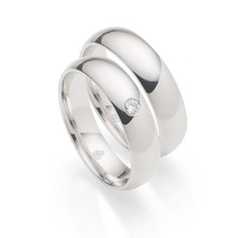 Eheringe aus Weißgold in gerundeter Außenform mit Diamanten