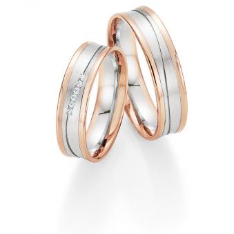Aufnahme von Eheringen aus Weiß- & Roségold leicht konkaver Form mit Diamanten