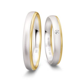 Trauringe aus sandmattem Weißgold und poliertem Gelbgold mit Diamant
