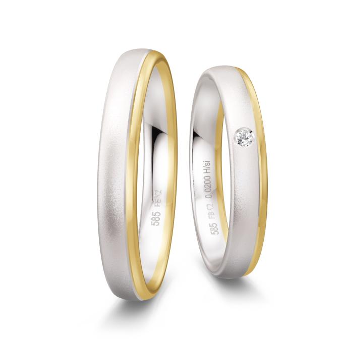 Trauringe aus sandmattem Weißgold und poliertem Gelbgold mit Diamant