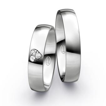 Polierte Eheringe aus Platin mit Herz aus Diamanten