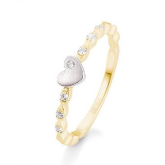 Aufnahme von einem Verlobungsring aus Weissgold&Gelbgold mit Herzenmuster und Diamanten